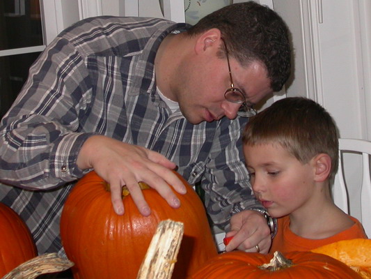 Josh and Ryan Carving Pumpkins by Misty Poulson